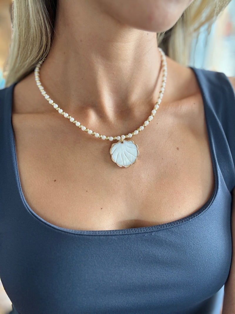 “Pearl Necklace with Seashell Pendant”